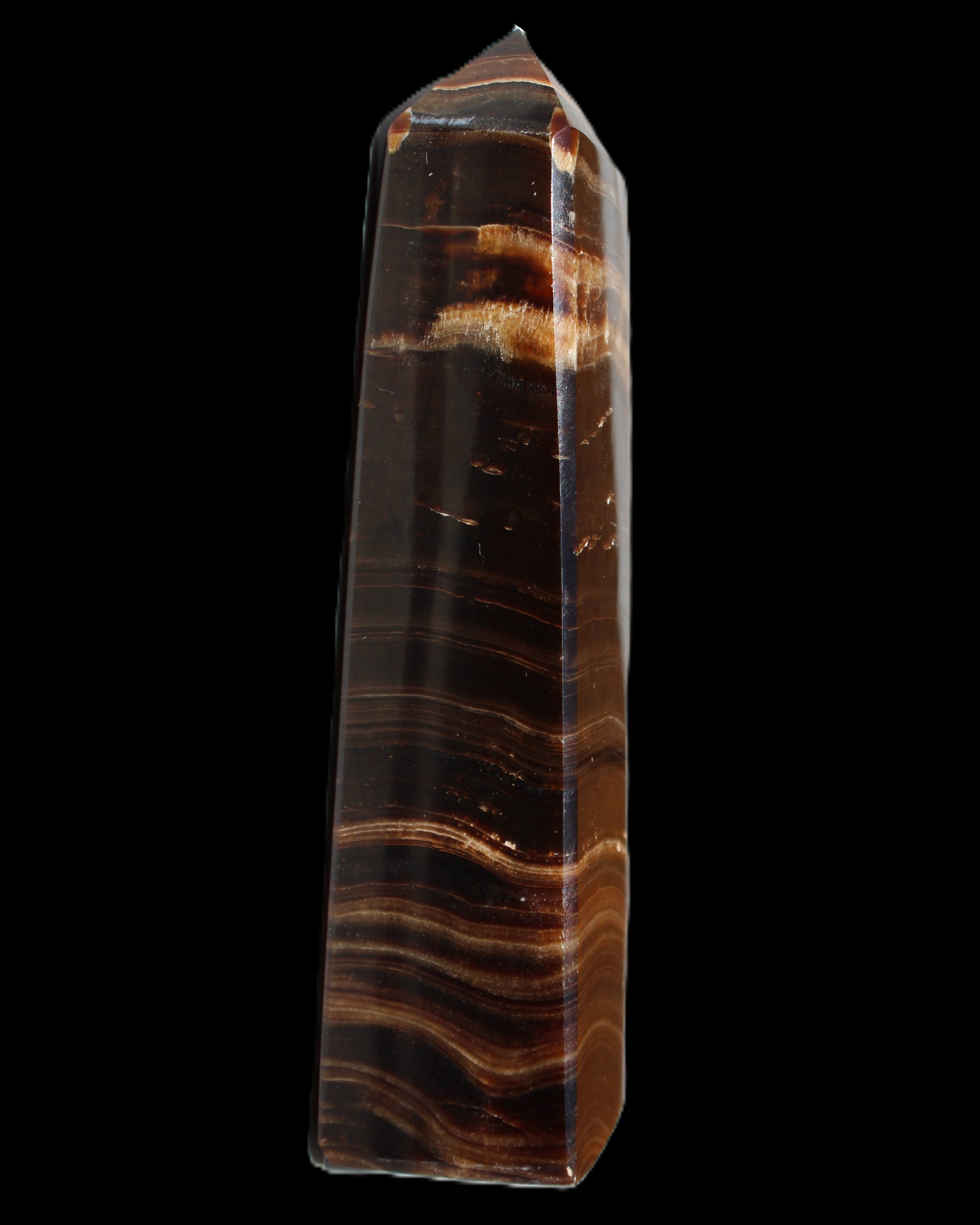 Chocolate Calcite obelisk 122*33mm 270g in sunlight - Rocks and Things Store