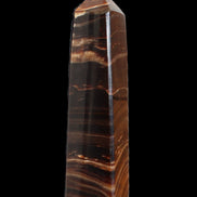 Chocolate Calcite obelisk 122*33mm 270g in sunlight - Rocks and Things Store