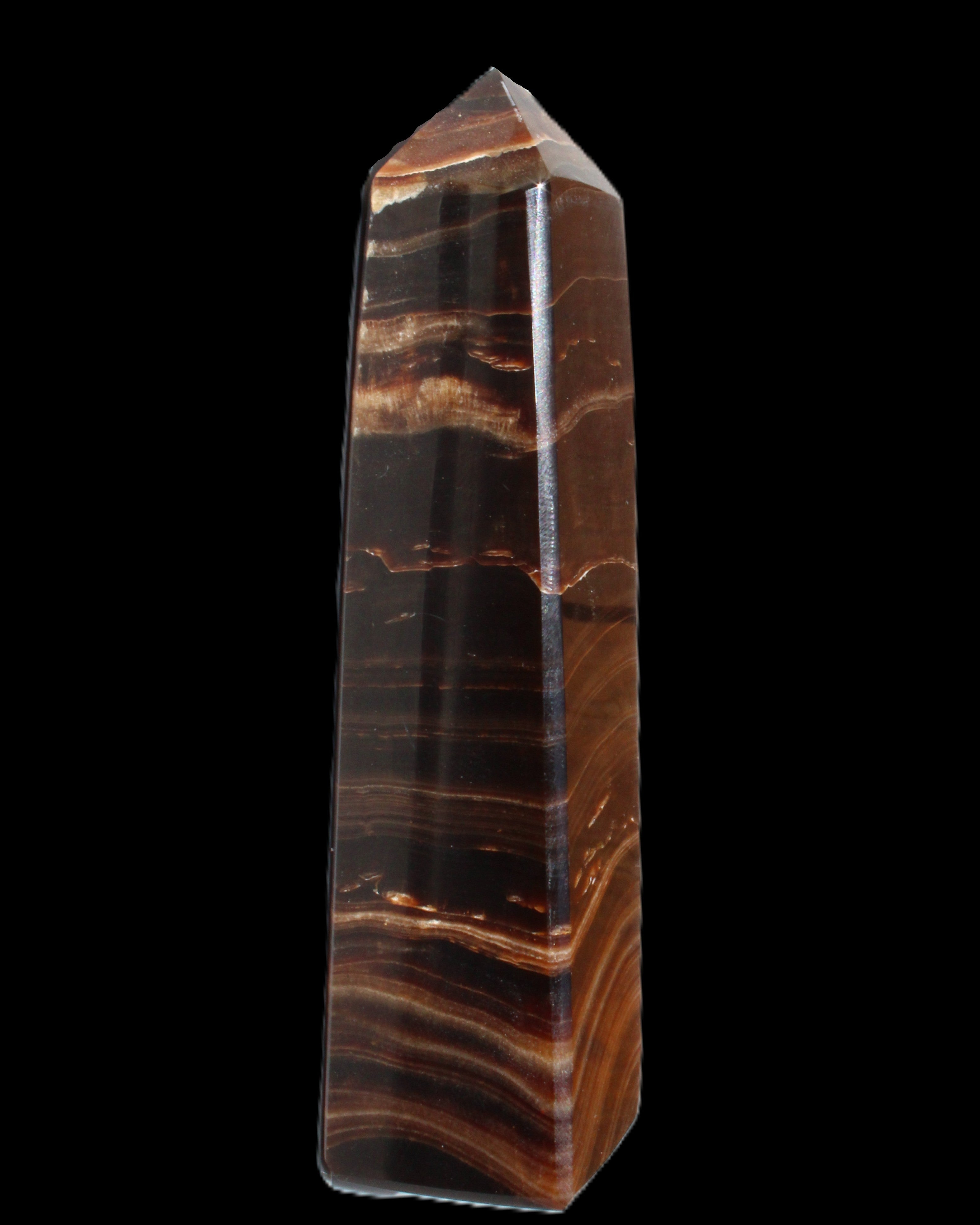 Chocolate Calcite obelisk 122*33mm 270g in sunlight - Rocks and Things Store