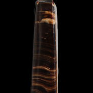 Chocolate Calcite obelisk 122*33mm 270g in sunlight - Rocks and Things Store