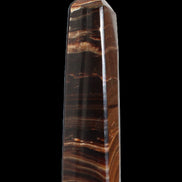 Chocolate Calcite obelisk 122*33mm 270g in sunlight - Rocks and Things Store