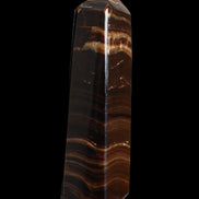 Chocolate Calcite obelisk 122*33mm 270g in sunlight - Rocks and Things Store