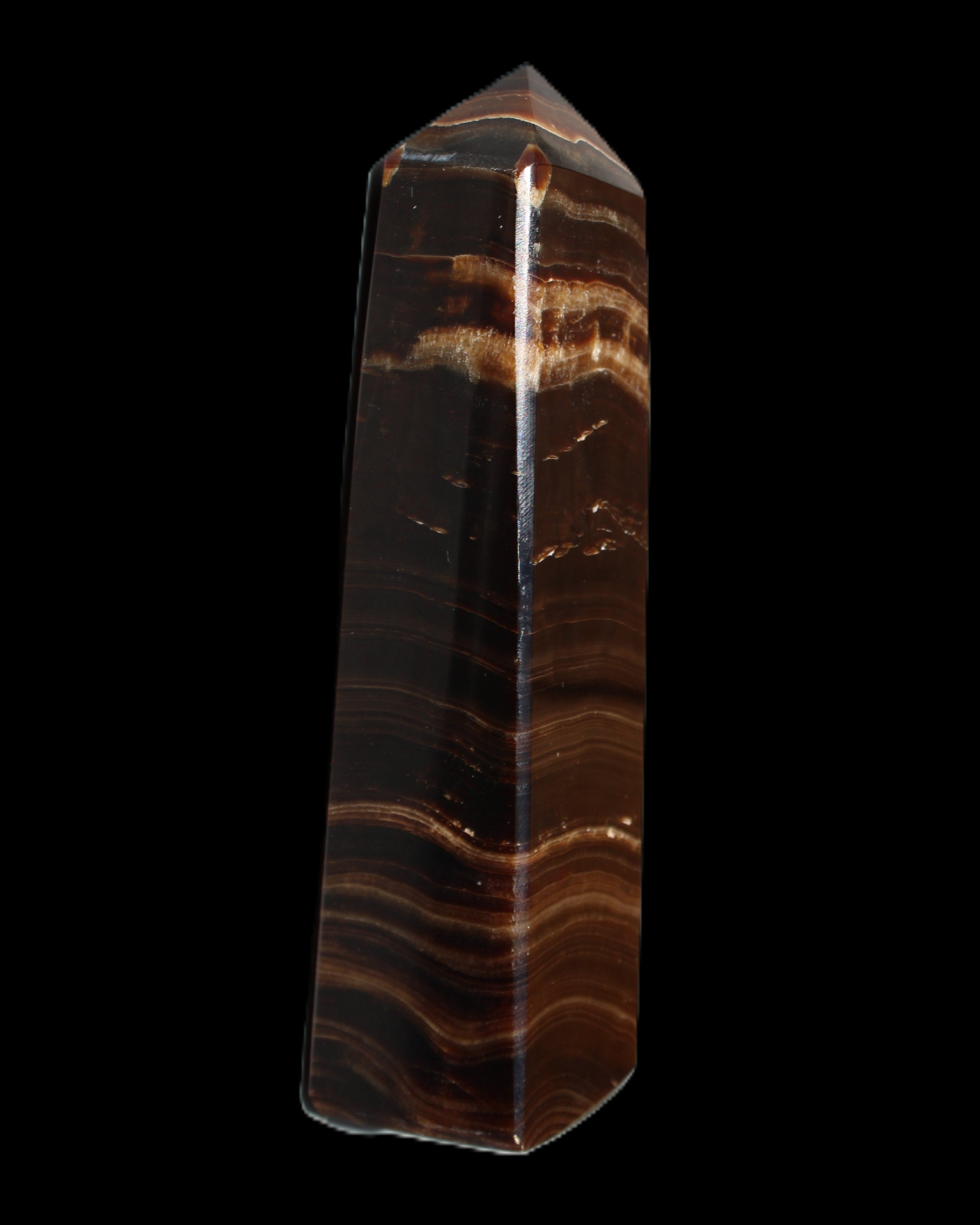 Chocolate Calcite obelisk 122*33mm 270g in sunlight - Rocks and Things Store