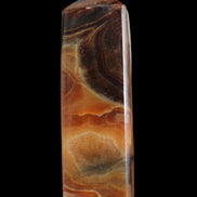 Chocolate Calcite obelisk 106*43mm 303g in sunlight - Rocks and Things Store