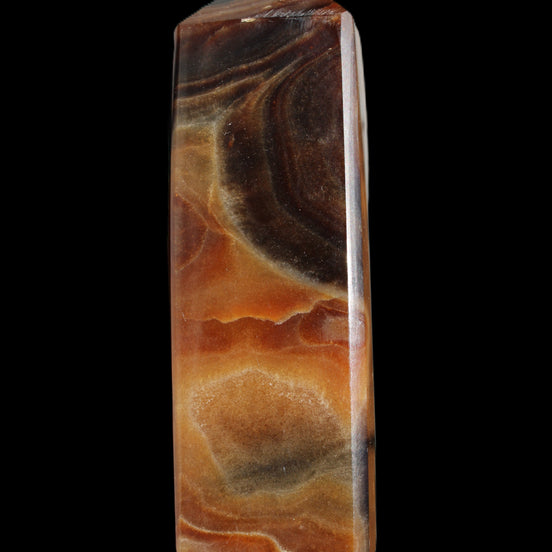 Chocolate Calcite obelisk 106*43mm 303g in sunlight - Rocks and Things Store