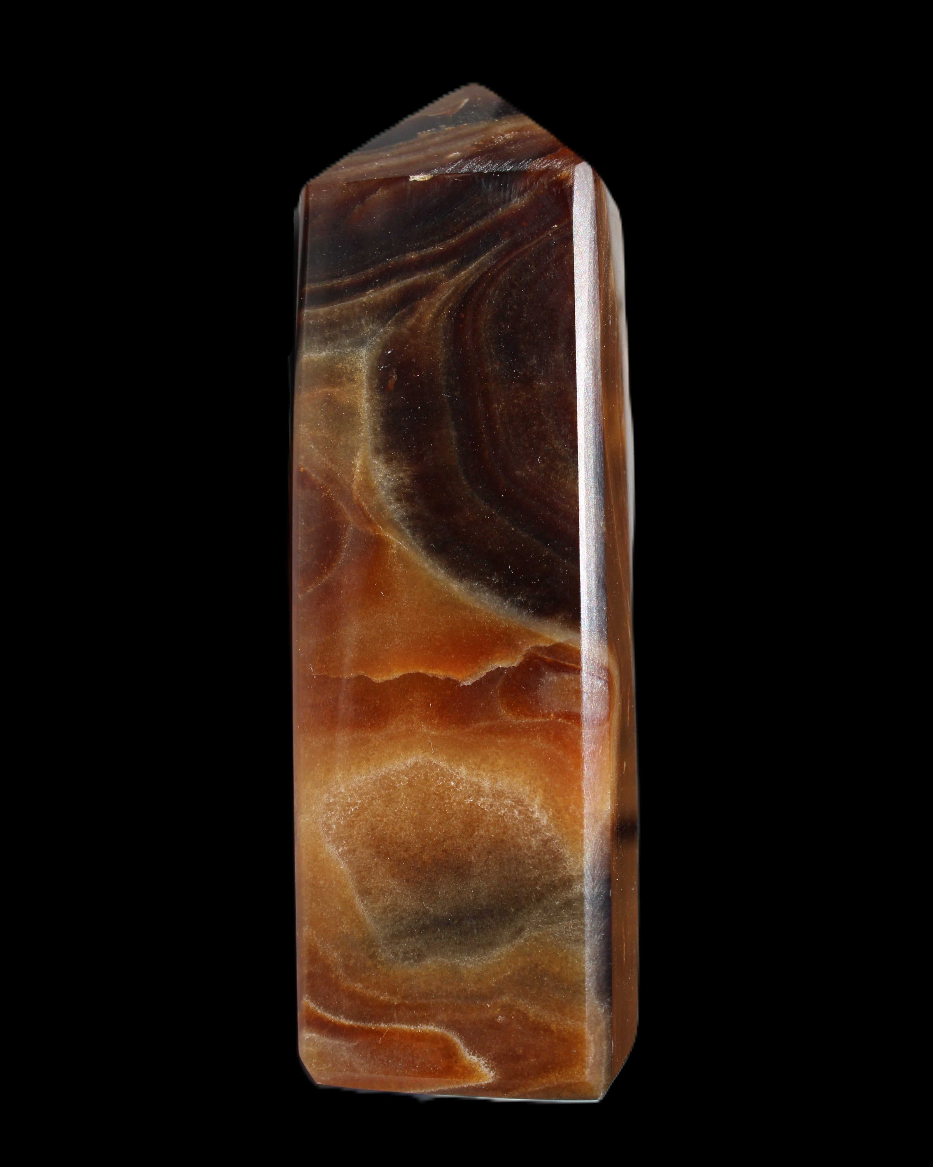 Chocolate Calcite obelisk 106*43mm 303g in sunlight - Rocks and Things Store