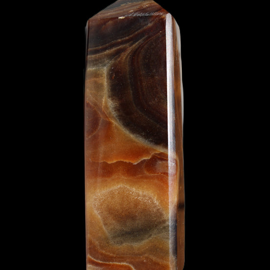Chocolate Calcite obelisk 106*43mm 303g in sunlight - Rocks and Things Store