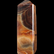Chocolate Calcite obelisk 106*43mm 303g in sunlight - Rocks and Things Store