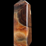 Chocolate Calcite obelisk 106*43mm 303g in sunlight - Rocks and Things Store