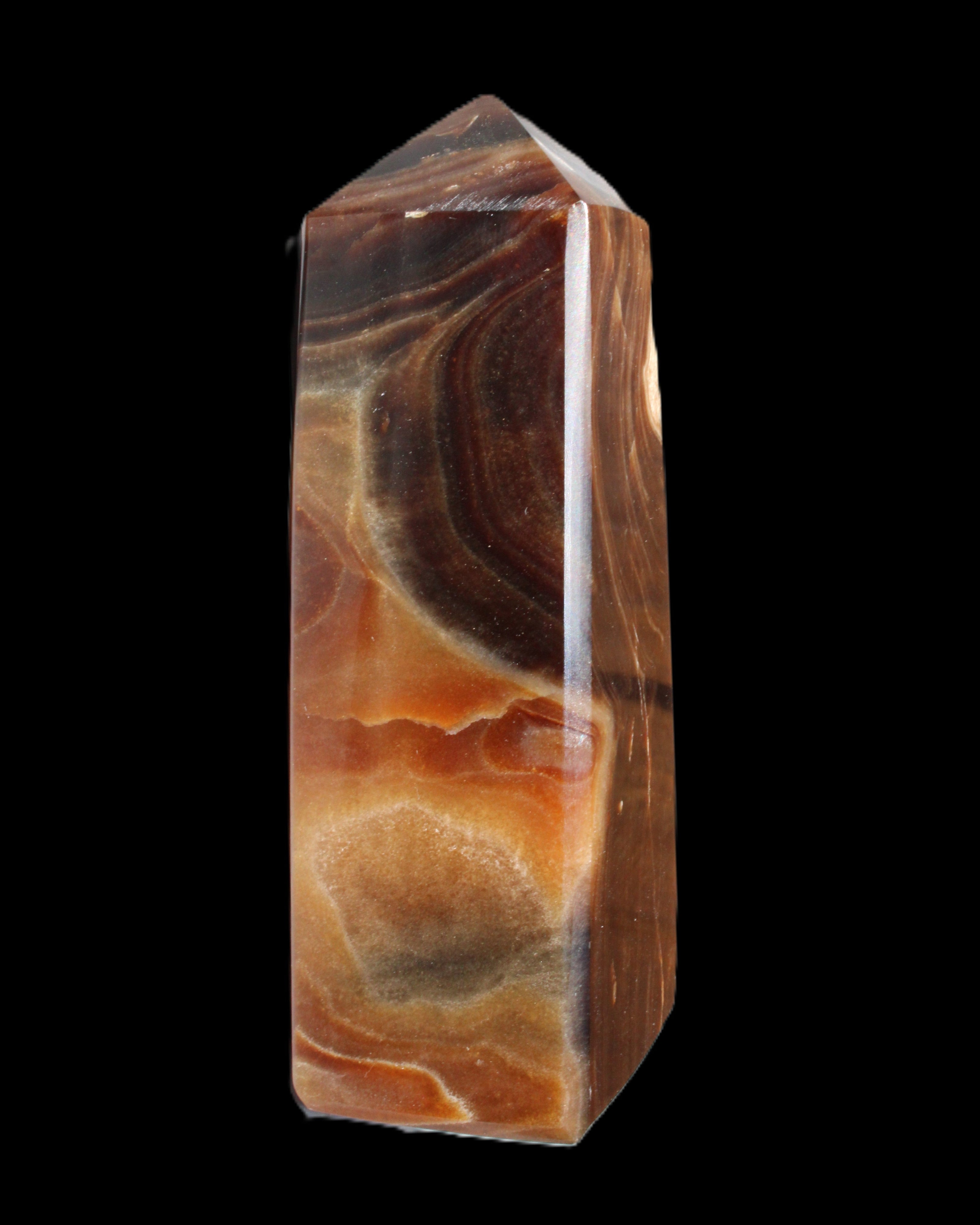 Chocolate Calcite obelisk 106*43mm 303g in sunlight - Rocks and Things Store