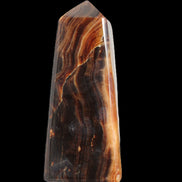 Chocolate Calcite obelisk 106*43mm 303g in sunlight - Rocks and Things Store