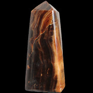 Chocolate Calcite obelisk 106*43mm 303g in sunlight - Rocks and Things Store