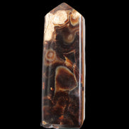 Chocolate Calcite obelisk 106*43mm 303g in sunlight - Rocks and Things Store