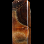 Chocolate Calcite obelisk 106*43mm 303g in sunlight - Rocks and Things Store