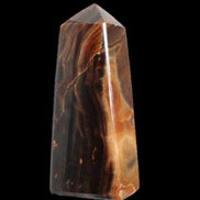 Chocolate Calcite obelisk 106*43mm 303g in sunlight - Rocks and Things Store
