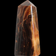 Chocolate Calcite obelisk 106*43mm 303g in sunlight - Rocks and Things Store