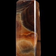 Chocolate Calcite obelisk 106*43mm 303g in sunlight - Rocks and Things Store