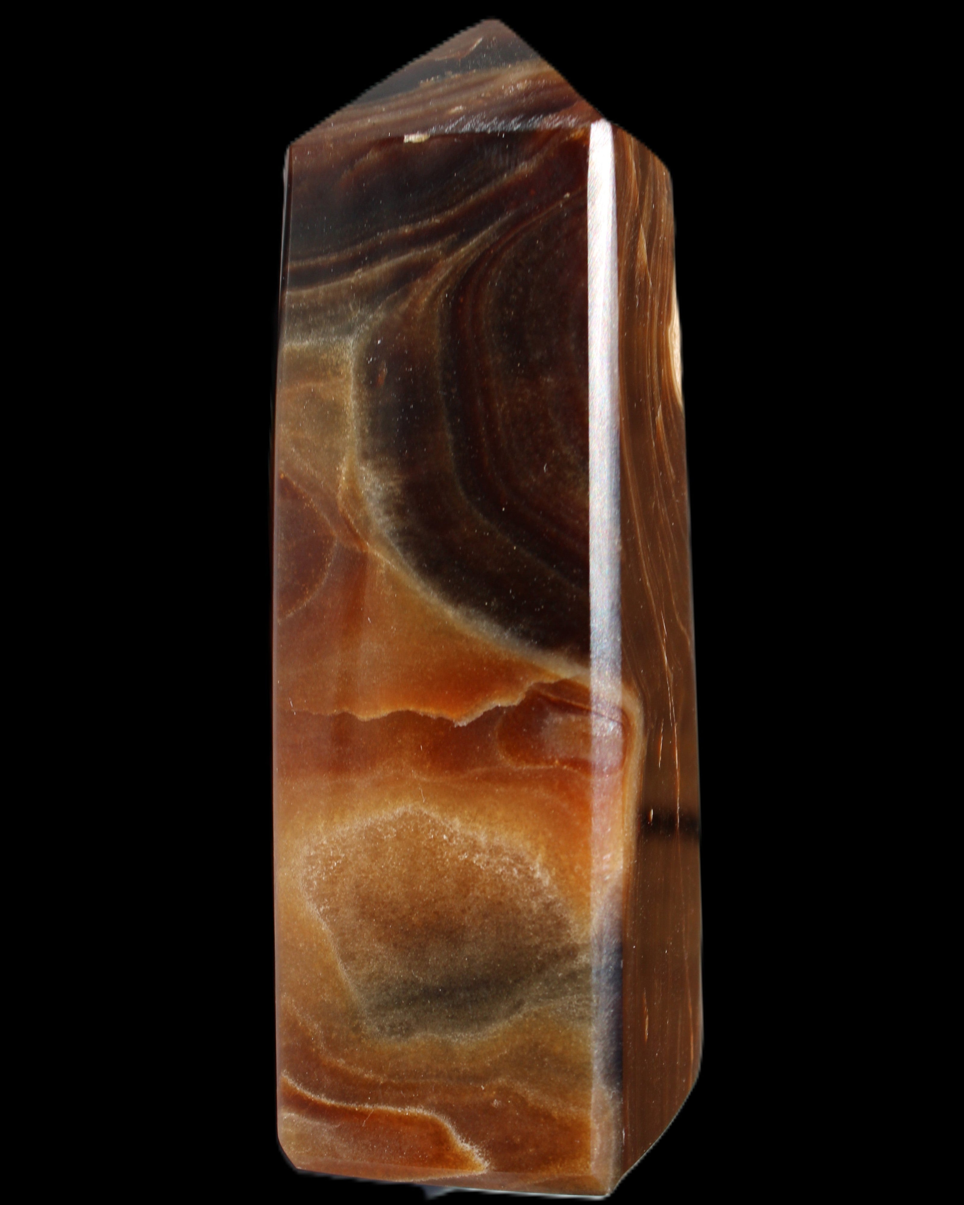 Chocolate Calcite obelisk 106*43mm 303g in sunlight - Rocks and Things Store
