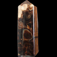 Chocolate Calcite obelisk 106*43mm 303g in sunlight - Rocks and Things Store