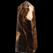 Chocolate Calcite obelisk 106*43mm 303g in sunlight - Rocks and Things Store