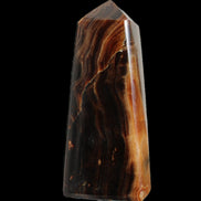 Chocolate Calcite obelisk 106*43mm 303g in sunlight - Rocks and Things Store