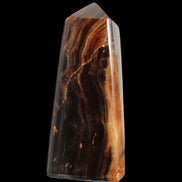 Chocolate Calcite obelisk 106*43mm 303g in sunlight - Rocks and Things Store