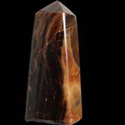 Chocolate Calcite obelisk 106*43mm 303g in sunlight - Rocks and Things Store