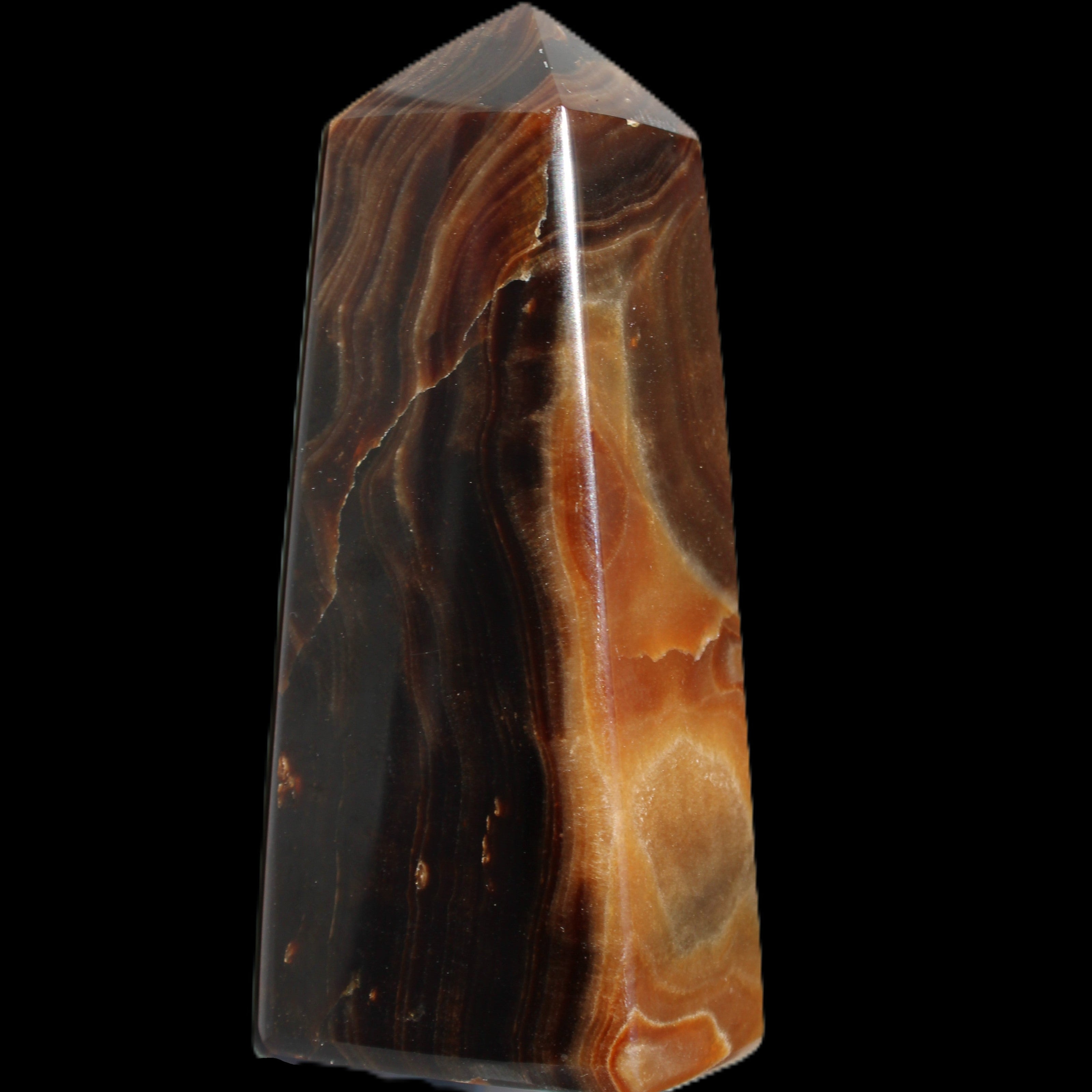 Chocolate Calcite obelisk 106*43mm 303g in sunlight - Rocks and Things Store