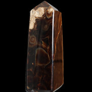 Chocolate Calcite obelisk 106*43mm 303g in sunlight - Rocks and Things Store