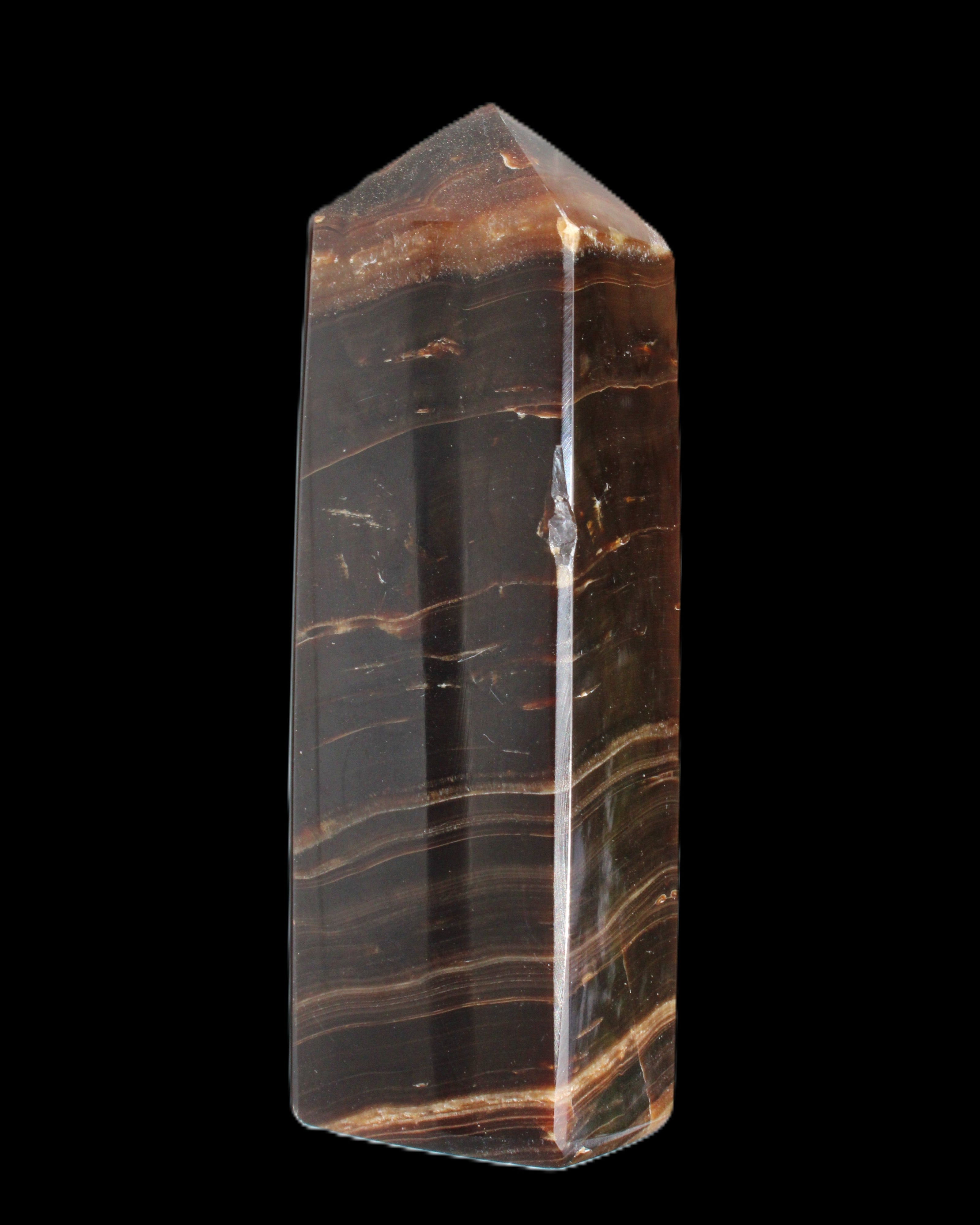 Chocolate Calcite obelisk 108*32mm 216g in sunlight - Rocks and Things Store