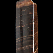 Chocolate Calcite obelisk 108*32mm 216g in sunlight - Rocks and Things Store