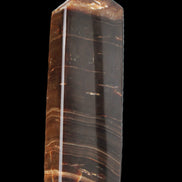 Chocolate Calcite obelisk 108*32mm 216g in sunlight - Rocks and Things Store