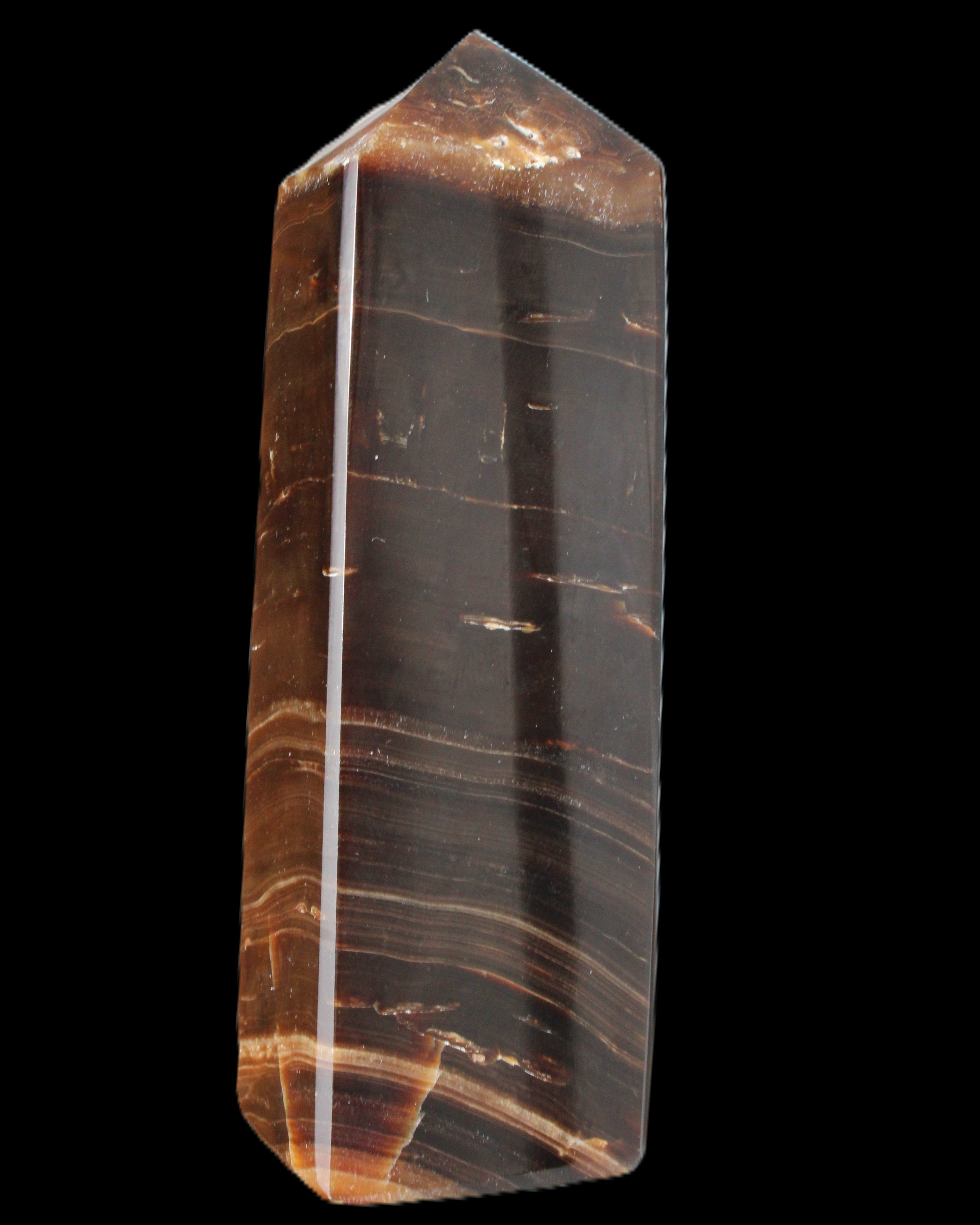Chocolate Calcite obelisk 108*32mm 216g in sunlight - Rocks and Things Store