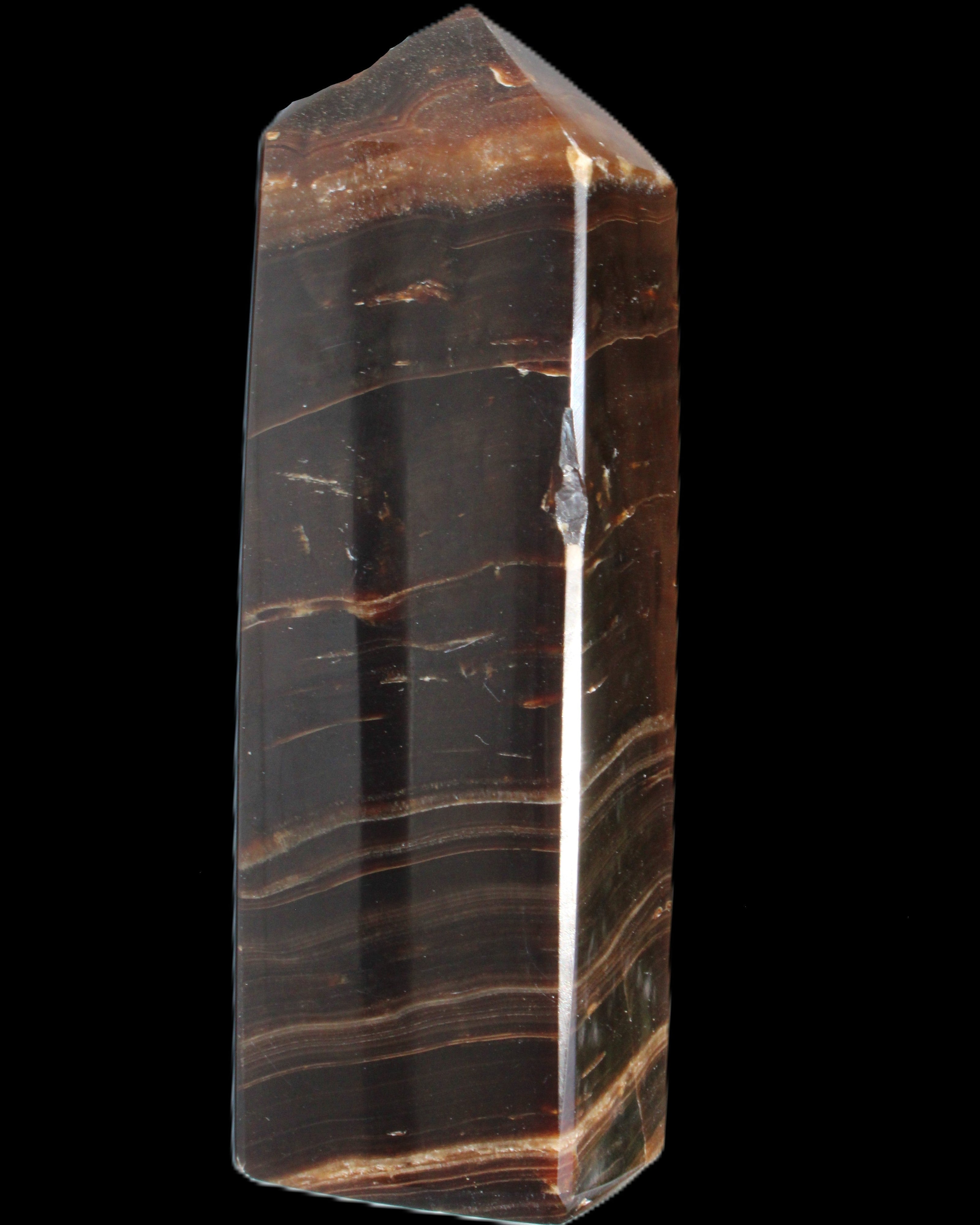 Chocolate Calcite obelisk 108*32mm 216g in sunlight - Rocks and Things Store