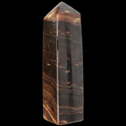 Chocolate Calcite obelisk 108*32mm 216g in sunlight - Rocks and Things Store