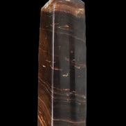 Chocolate Calcite obelisk 108*32mm 216g in sunlight - Rocks and Things Store
