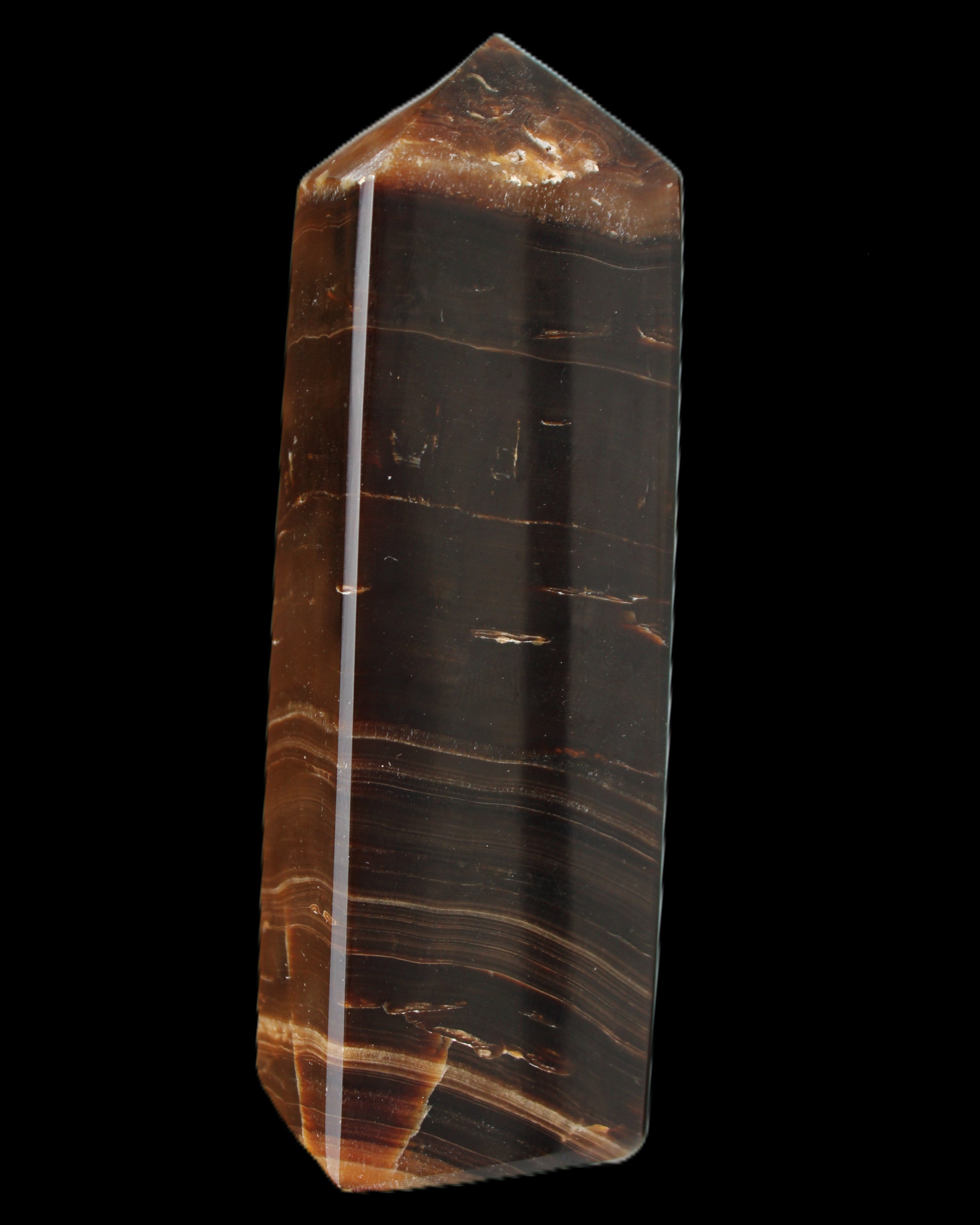 Chocolate Calcite obelisk 108*32mm 216g in sunlight - Rocks and Things Store