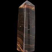 Chocolate Calcite obelisk 108*32mm 216g in sunlight - Rocks and Things Store