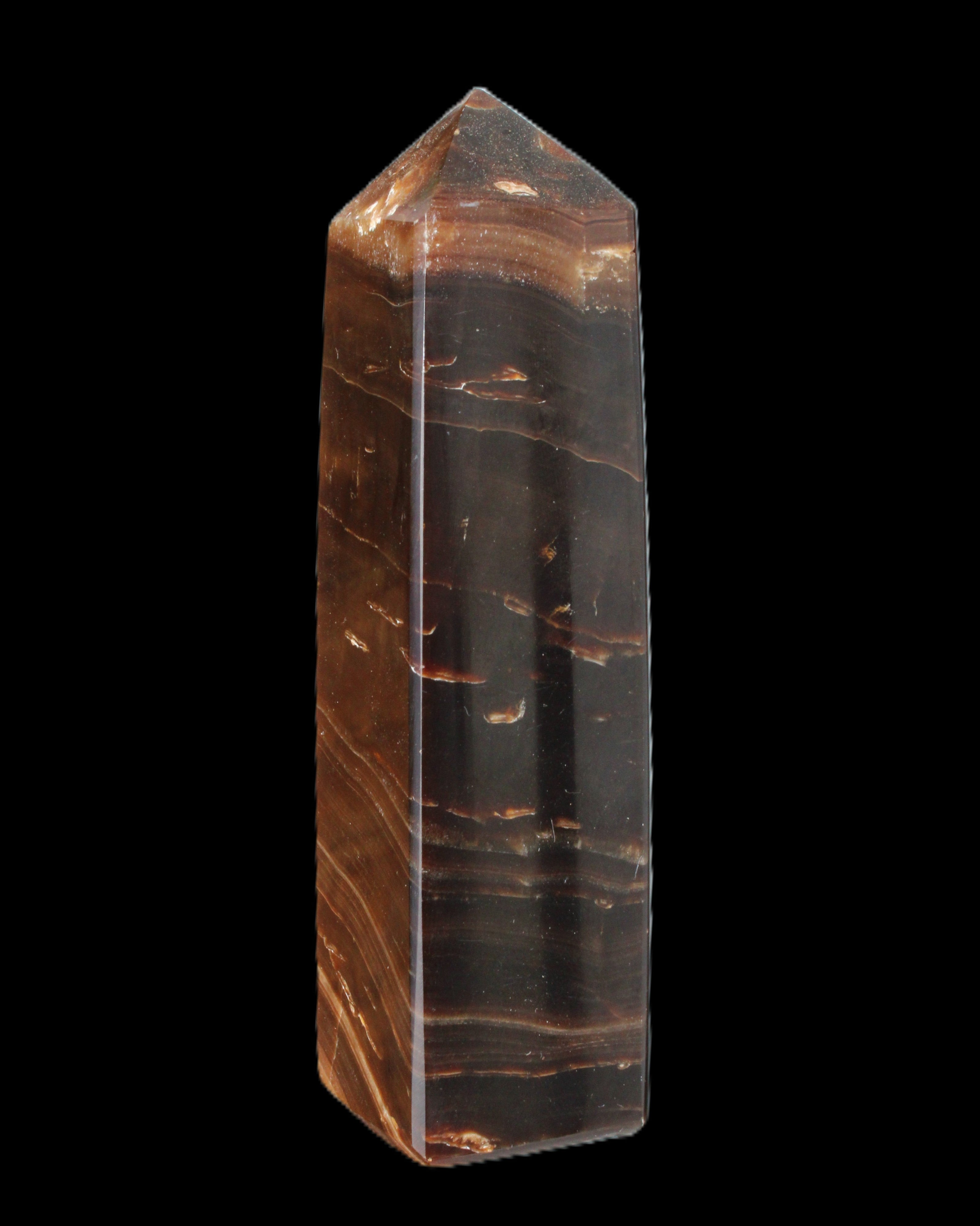 Chocolate Calcite obelisk 108*32mm 216g in sunlight - Rocks and Things Store