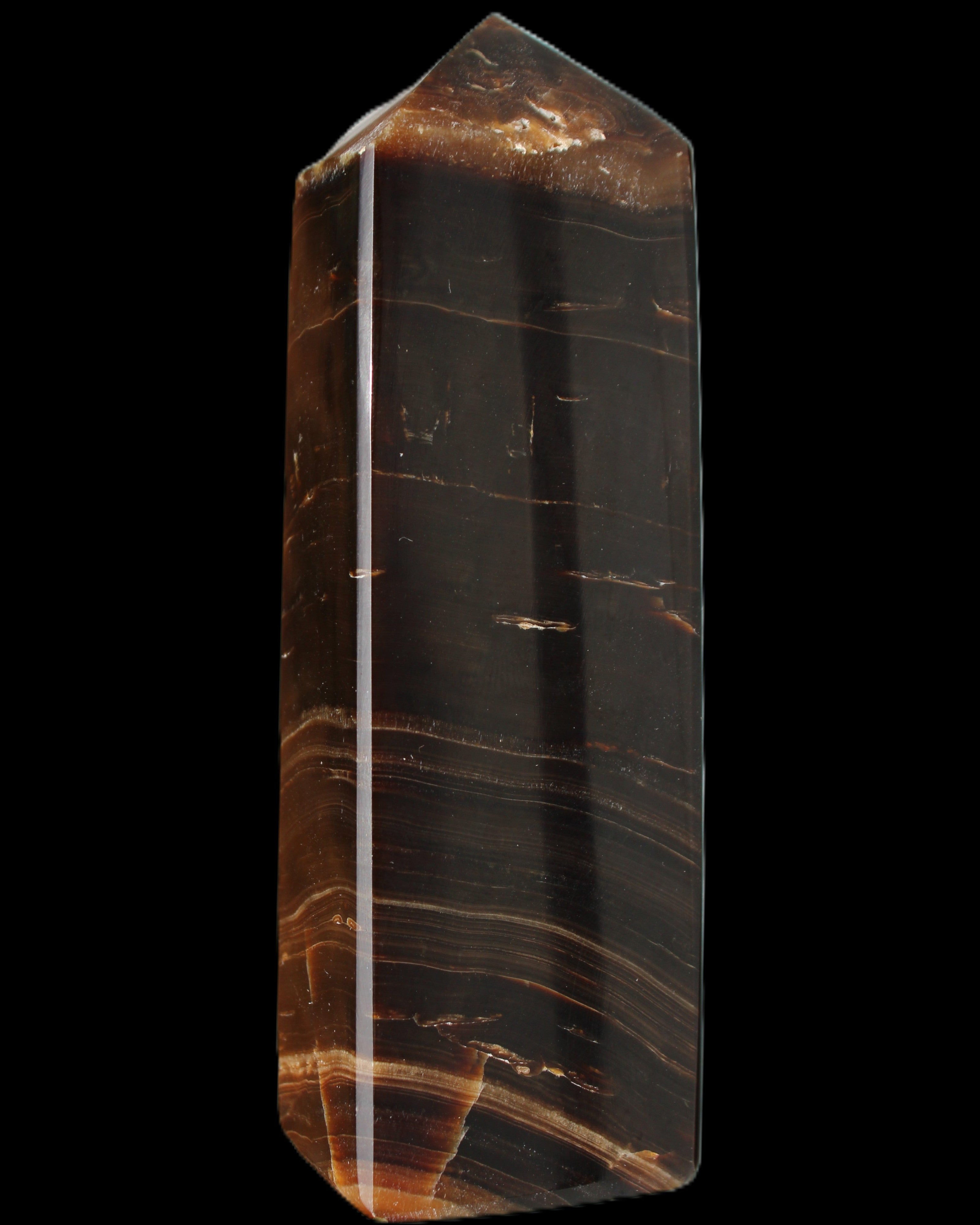 Chocolate Calcite obelisk 108*32mm 216g in sunlight - Rocks and Things Store