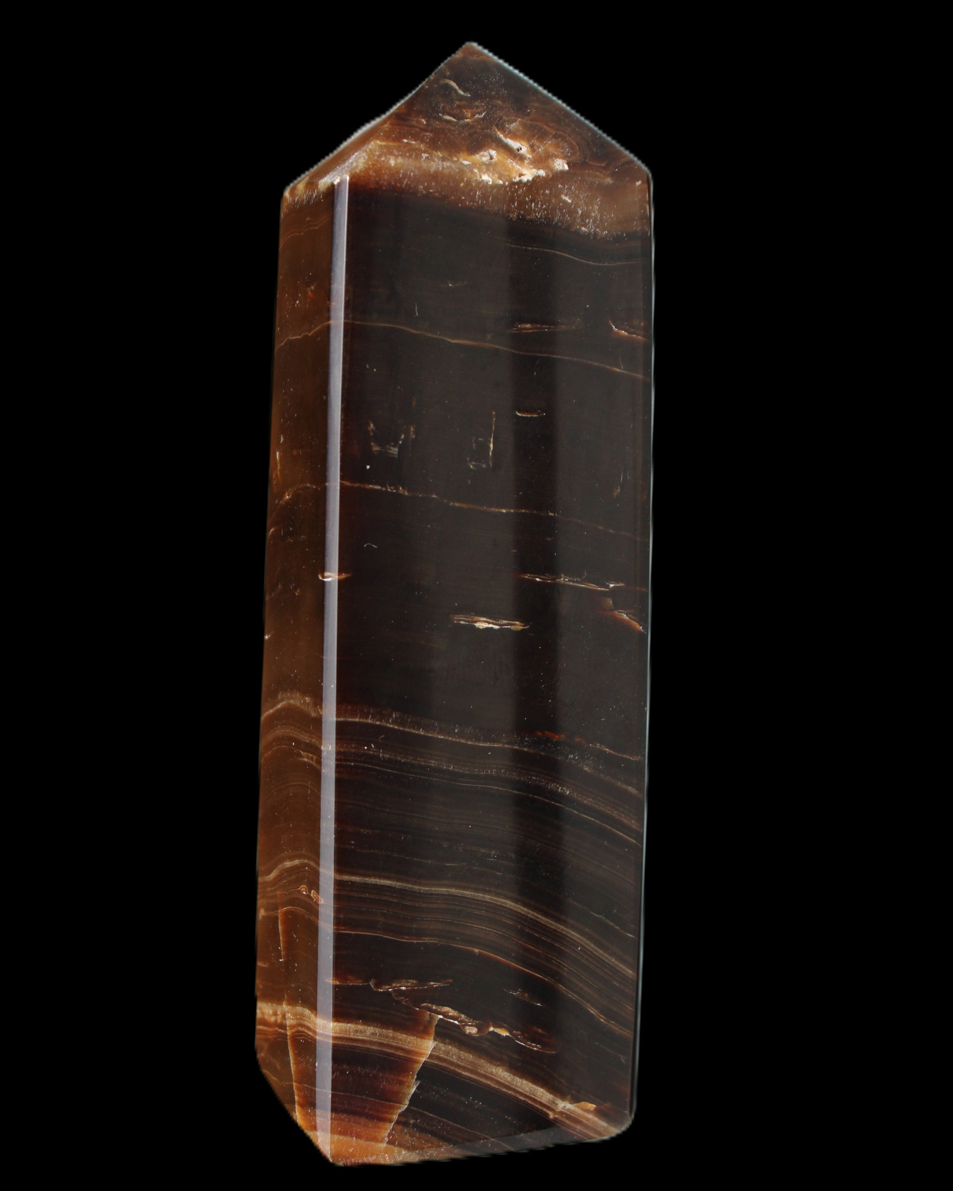 Chocolate Calcite obelisk 108*32mm 216g in sunlight - Rocks and Things Store