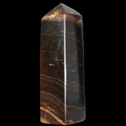 Chocolate Calcite obelisk 108*32mm 216g in sunlight - Rocks and Things Store
