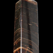 Chocolate Calcite obelisk 108*32mm 216g in sunlight - Rocks and Things Store