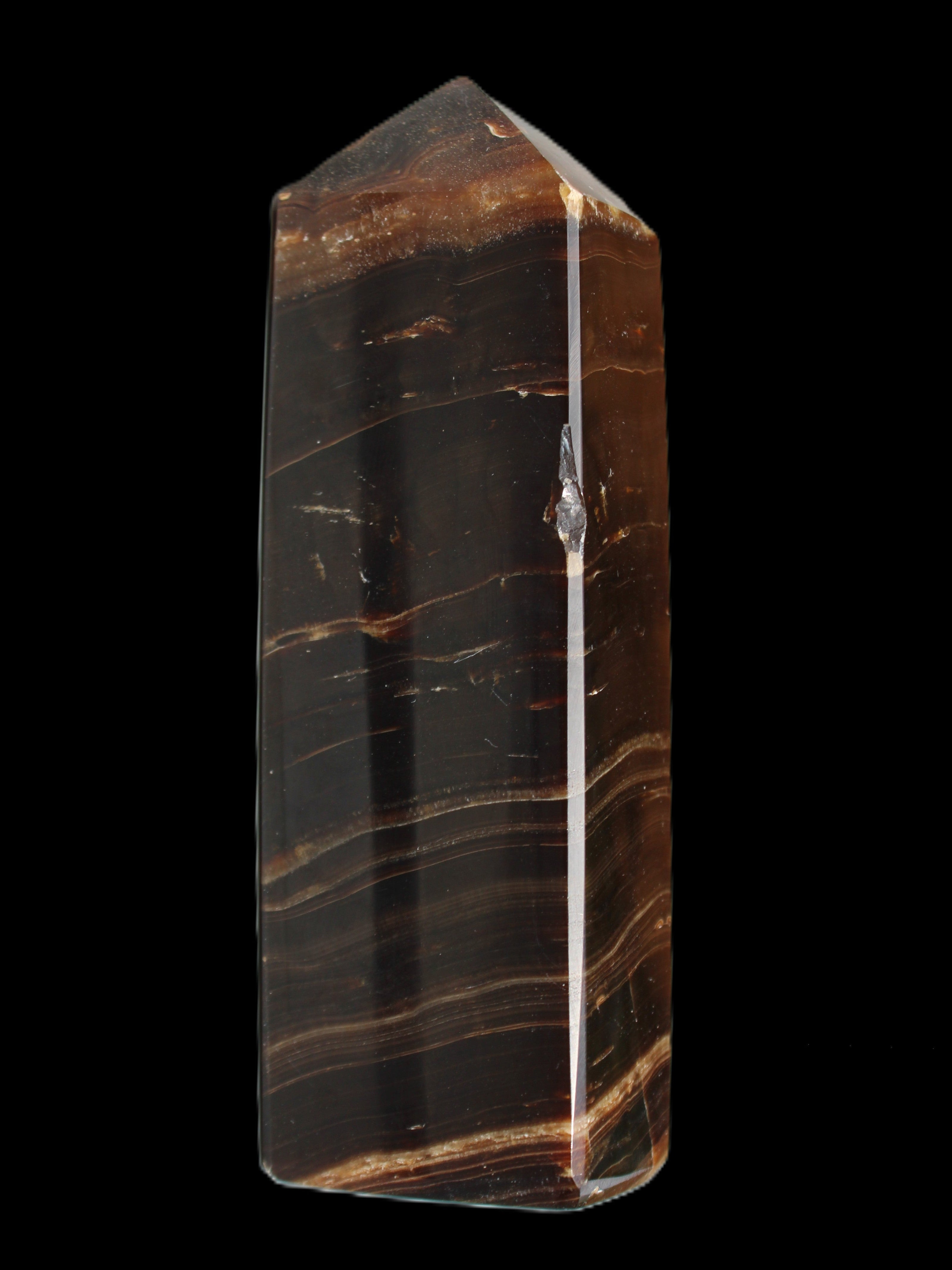 Chocolate Calcite obelisk 108*32mm 216g in sunlight - Rocks and Things Store