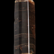 Chocolate Calcite obelisk 108*32mm 216g in sunlight - Rocks and Things Store