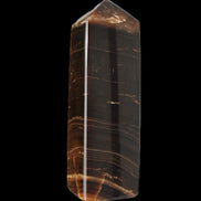 Chocolate Calcite obelisk 108*32mm 216g in sunlight - Rocks and Things Store
