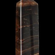 Chocolate Calcite obelisk 108*32mm 216g in sunlight - Rocks and Things Store
