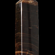 Chocolate Calcite obelisk 108*32mm 216g in sunlight - Rocks and Things Store