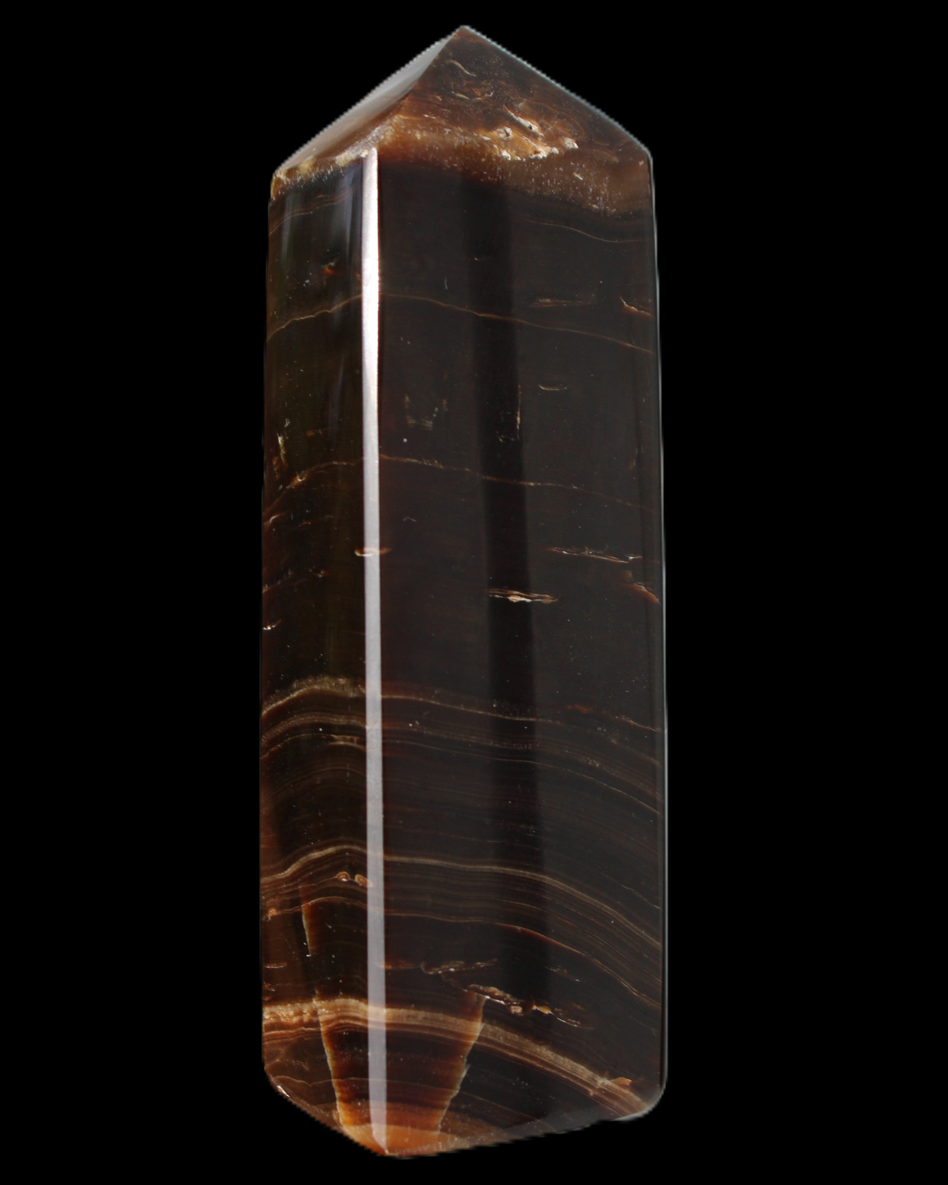 Chocolate Calcite obelisk 108*32mm 216g in sunlight - Rocks and Things Store
