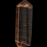 Chocolate Calcite obelisk 108*32mm 216g in sunlight - Rocks and Things Store